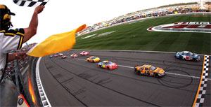 Greg Biffle crosses the finish line to win at Kansas Speedway. (Photo Credit: Jamie Squire / Getty Images)