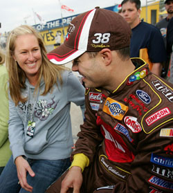 David Gilliland (right) and wife Michelle are all smiles at Daytona International Speedway where Gilliland won the pole for the Daytona 500 in February of 2007. (Photo Credit: Jonathan Ferrey/Getty Images for NASCAR