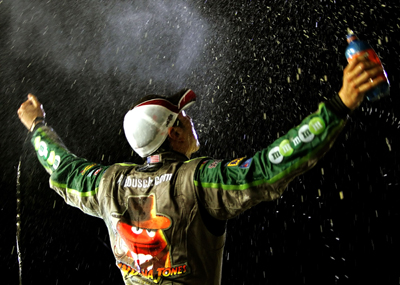 After winning the Dodge Challenger 500 NASCAR Sprint Cup Series event at Darlington Raceway, Kyle Busch gets doused by the No. 18 team in victory lane (Photo Credit: Jason Smith/Getty Images for NASCAR)