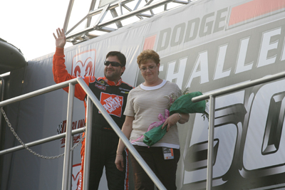 Tony Stewart and his mother, Pam Boas, wave to the Darlington Raceway crowd during driver introductions for the Dodge Challenger 500 (Photo Credit: Jerry Markland/Getty Images for NASCAR)