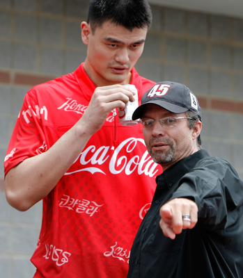 Yao Ming (L) talks with Kyle Petty (R) prior to the NASCAR Sprint Cup Series Coca-Cola 600 on May 25, 2008 at Lowe's Motor Speedway in Concord, North Carolina. (Photo by Streeter Lecka/Getty Images)