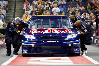 The No. 83 Red Bull Toyota pit crew of Brian Vickers pushes their car towards the finish line during the Craftsman 40-Yard Push. The crew won the championship, setting a new speed record along the way. (Photo Credit: John Harrelson/Getty Images for NASCAR)