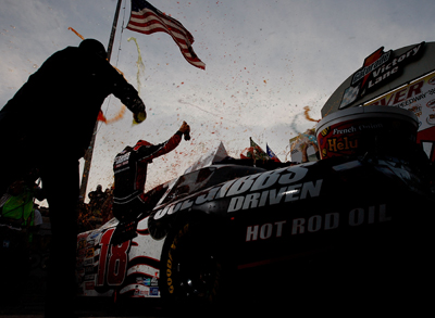 Denny Hamlin celebrates his second victory and fifth top-10 finish in seven races at Dover International Speedway. (Photo Credit: Nick Laham/Getty Images)
