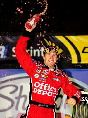 Carl Edwards celebrates winning the Sharpie 500 at Bristol Motor Speedway. The win was Edwards' third in the last four races and secured his spot in the Chase for the NASCAR Sprint Cup. (Photo Credit: Rusty Jarrett/Getty Images for NASCAR)