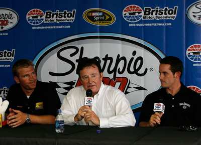 Richard Childress (center) announces that Casey Mears (right) will join RCR in 2009 and drive the No. 07 Jack Daniel's Chevrolet. Clint Bowyer (left) will move to a new fourth RCR team, the No. 33 Cheerios Chevrolet. (Photo Credit: Kevin C. Cox/Getty Images)