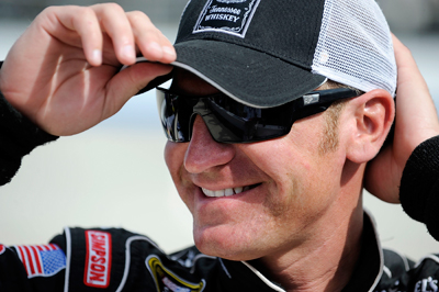 Even though he's pulling double duty this weekend by competiting in both the NASCAR Sprint Cup Series Camping World RV 400 and the NASCAR Nationwide Series Camping World RV Sales 200, driver Clint Bowyer is all smiles in the garage during Friday's practice at Dover International Speedway. (Photo Credit: Jeff Zelevansky/Getty Images for NASCAR)