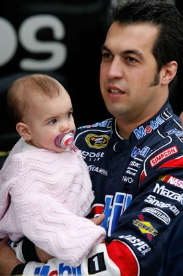 Sam Hornish Jr., driver of the #77 Mobil 1 Dodge, with his daughter Addison before practice for the NASCAR Sprint Cup Series Pep Boys Auto 500 at Atlanta Motor Speedway on October 24, 2008 in Hampton, Georgia. (Photo by John Harrelson/Getty Images for NASCAR)