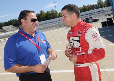 Current Drive for Diversity participant Paul Harraka, who won the track championship at All American Speedway in Roseville, Calif., chats with team owner Bill McAnally during the Drive for Diversity Combine presented by Sunoco at South Boston Speedway. (Photo Credit: Grant Halverson/Getty Images for NASCAR)