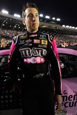 Kyle Busch, driver of the #18 M&M's/Susan G. Komen Toyota, stands on the grid prior to the start of the NASCAR Sprint Cup Series Bank of America 500 at Lowe's Motor Speedway on October 11, 2008 in Concord, North Carolina. (Photo by Rusty Jarrett/Getty Images for NASCAR)