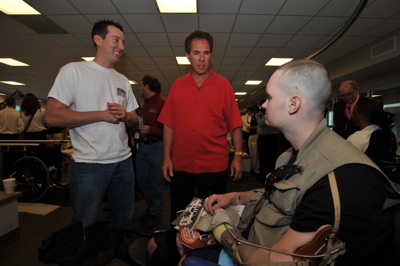 (Left to right) NASCAR Sprint Cup Series driver Kyle Busch and former NASCAR champion Darrell Waltrip visit a soldier at Walter Reed Army Medical Center's Military Advance Training Center in Washington, D.C. NASCAR made its annual visit to the facility to salute the troops on Thursday. (Photo Credit: Larry French/Getty Images for NASCAR)