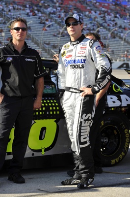 Jimmie Johnson (right), driver of the No. 48 Lowes Chevrolet stands with his car chief Ron Malec (left), started seventh and finished 15th in Sunday's NASCAR Sprint Cup event at Texas Motor Speedway. (Courtesy Hendrick Motorsports).