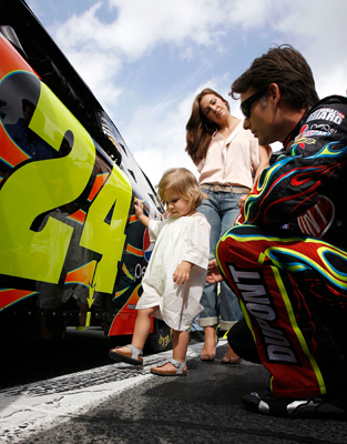 Some might say Jeff Gordon, driver of the No. 24 DuPont Chevrolet, may have had a couple of good luck charms Thursday at NASCAR Sprint Cup Series Gatorade Duel 1. Wife Ingrid Vandebosch and daughter Ella Sophia hang out with the four-time NASCAR champion the grid prior to the race at Daytona International Speedway that he won. (Photo Credit: Jason Smith/Getty Images for NASCAR)