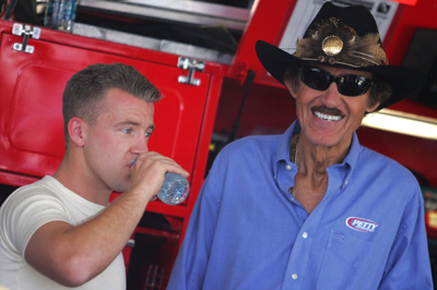 AJ Allmendinger shares a moment with team owner Richard Petty after the team announced Allmendinger has signed a contract to remain at Richard Petty Motorsports through the end of 2010. (Photo Credit: Todd Warshaw/Getty Images)