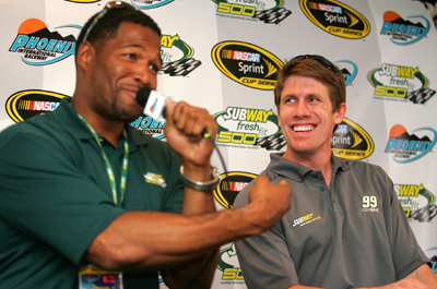 Subway Fresh Fit 500 Grand Marshall Michael Strahan and Carl Edwards share a laugh in the media center before the race. (Photo Credit: Todd Warshaw/Getty Images)