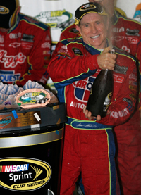 Mark Martin celebrates in Victory Lane for the first time in 97 starts. His last win was at Kansas Speedway in October 2005. (Photo Credit: Jerry Markland/Getty Images for NASCAR)
