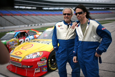 Foreigner chief songwriter /guitarist/keyboardist and founding member Mick Jones and lead singer Kelly Hansen reflect on the experience after taking a ride in a Team Texas stock car at Texas Motor Speedway Monday, March 30, 2009. The band is headlining the AMDRO Fire Ant Bait Pre-Race Show beginning at 11:35 a.m. CT, prior to the start of the Samsung 500 NASCAR Sprint Cup Series race on Sunday, April 5th at Texas Motor Speedway. (Photo By Tom Pennington/Getty Images for the Texas Motor Speedway)
