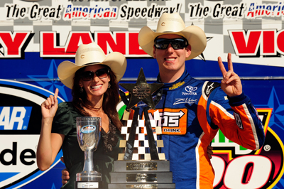 Kyle Busch (R), driver of the #18 Snickers Toyota, poses with his girlfriend Samantha Sarcinella in victory lane after winning the NASCAR Nationwide Series O'Reilly 300 at Texas Motor Speedway on April 4, 2009 in Fort Worth, Texas. (Photo by Rusty Jarrett/Getty Images for Texas Motor Speedway)