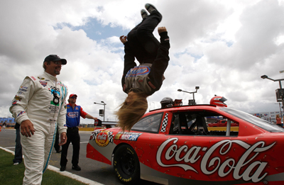 Shawn Johnson flips as Kyle Petty looks on at Lowe's Motor Speedway (credit: NASCAR)