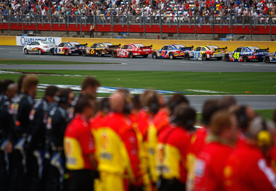 The Coca-Cola 600 was stopped just short of 3 p.m. ET to observe the National Moment of Remembrance. The cars lined up on the frontstretch and shut down the engines and crew members lined up the length of pit road to honor members of the military. (Photo Credit: Jason Smith/Getty Images)