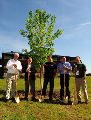 (Left to right) Rex Boner of The Conservation Fund, Mike Lynch, Managing Director of Green Innovation for NASCAR, Ryan Newman, Sprint Cup Series Driver, Roger Curtis, President of Michigan International Speedway and Kevin Sayers, Michigan State Coordinator of Urban and Community Forestry Program Kevin Sayers plant a tree for NASCAR's Tree-Planting Program To Capture Carbon Emissions prior to practice for the NASCAR Sprint Cup Series LifeLock 400 at Michigan International Speedway on Friday in Brooklyn, Mich. (Photo Credit: Rusty Jarrett/Getty Images for NASCAR)