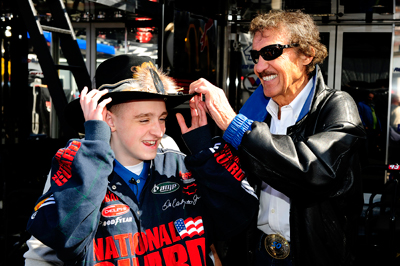 Richard Petty did the unthinkable for 13-year-old Thomas Harkins Jr. -- shared his famous hat. The New York City Spelling Bee champion met with Petty on Saturday morning in the garage at Pocono Raceway. (Photo Credit: Sam Greenwood/Getty Images)