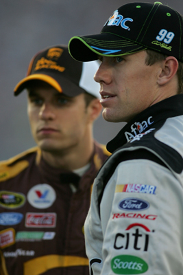 Teammates David Ragan (left), driver of the No. 6 UPS Ford, and Carl Edwards (right), driver of the No. 99 Aflac Ford, chat during Thursday's qualifying for the NASCAR Sprint Cup Series LifeLock.com 400 at Chicagoland Speedway on Saturday in Joliet, Ill. (Photo Credit: Todd Warshaw/Getty Images)