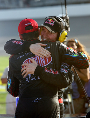 Race runner-up Jeff Gordon, driver of the No. 24 Dupont Chevrolet, congratulates Brian Vickers (right), driver of the No. 83 Red Bull Toyota, after the 25-year-old won Sunday's NASCAR Sprint Cup Series CARFAX 400 at Michigan International Speedway in Brooklyn, Mich. (Photo Credit: Jerry Markland/Getty Images for NASCAR)