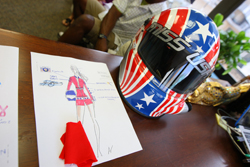 The design and helmet for 2009 Miss USA Kristen Dalton's NASCAR-themed costume for the Miss Universe Pageant are on display at Miss Universe Pageant Headquarters in New York City. (Photo Credit: Mike Stobe/Getty Images for NASCAR)