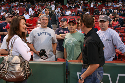 Greg and Nicole chat with some NASCAR fans on the field prior to the Red Sox game in Boston on Tuesday, Sept. 8. (Photo Credit: NHMS)