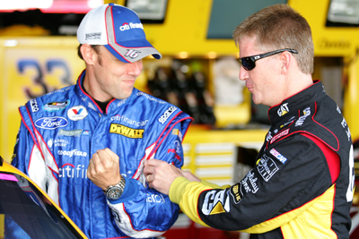 Former Roush Fenway Racing teammates Jeff Burton and Matt Kenseth joke around in the garage before practice for the AAA 400 at Dover International Speedway. (Photo Credit: Todd Warshaw/Getty Images for NASCAR)