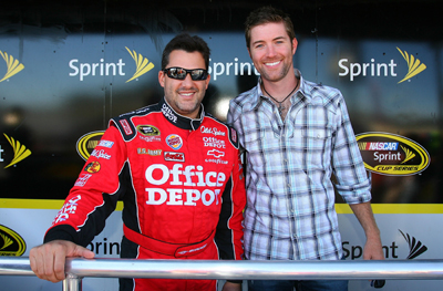 (Left to right) Tony Stewart, driver of the No. 14 Old Spice/Office Depot Chevrolet, poses with country music singer Josh Turner, prior to the start of the NASCAR Sprint Cup Series Sylvania 300 at the New Hampshire Motor Speedway on Sunday in Loudon, N.H. (Photo Credit: Jason Smith/Getty Images for NASCAR)