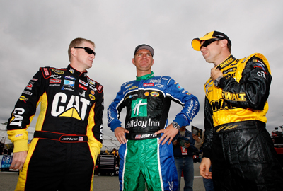 Jeff Burton, driver of the No. 31 Caterpillar Chevrolet, Clint Bowyer, driver of the No. 33 Holiday Inn Chevrolet, and Matt Kenseth, driver of the No. 17 Dewalt Ford, talk in the garage area during Friday's practice for the NASCAR Sprint Cup Series Chevy Rock & Roll 400 at Richmond International Raceway in Richmond, Va. (Photo Credit: Streeter Lecka/Getty Images)
