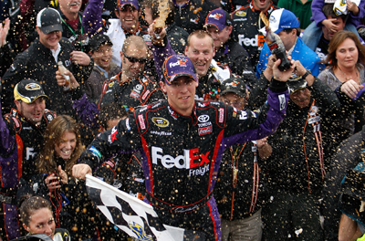 Denny Hamlin celebrates winning the TUMS Fast Relief 500 at Martinsville Speedway, his second career win at the Virginia short track. (Photo Credit: Geoff Burke/Getty Images for NASCAR)