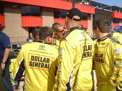 The No. 32 Dollar General pit crew get pumped up before the start of the Copart 300 on Saturday, October 10, 2009 at Auto Club Speedway in Fontana, CA (photo credit: The Fast and the Fabulous)