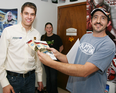 Longtime season ticket holder Mike Bruno Jr., right, poses with his tickets to Feb. 14's NASCAR Sprint Cup Series Daytona 500 and driver of the No. 6 UPS Ford, David Ragan on Tuesday as Ragan hand-delivered him tickets for NASCAR Sprint Cup Series Daytona 500 on Feb. 14, 2010. (Photo Credit: Jerry Markland/Daytona International Speedway)
