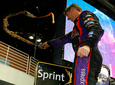 Denny Hamlin celebrates winning the Ford 400 at Homestead-Miami Speedway, his fourth victory of the season. (Photo Credit: Jason Smith/Getty Images for NASCAR)