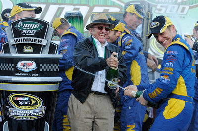 (Center to right) Team owner Jack Roush and Jamie McMurray, driver of the No. 26 IRWIN Marathon Ford, celebrate in McMurray's third career win in Victory Lane after winning the NASCAR Sprint Cup Series AMP Energy 500 at Talladega Superspeedway on Sunday in Talladega, Ala. (Photo Credit: John Harrelson/Getty Images for NASCAR)
