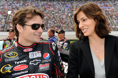 Jeff Gordon, driver of the No. 24 DuPont Chevrolet, stands on pit road with his wife Ingrid Vandebosch before the start of the NASCAR Sprint Cup Series Dickies 500 at Texas Motor Speedway on Sunday in Fort Worth, Texas. (Photo Credit: Rusty Jarrett/Getty Images for NASCAR)
