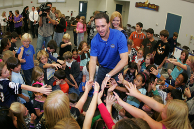 Four-time NASCAR Sprint Cup Champion Jimmie Johnson, driver of the No. 48 Lowe's Chevrolet, and his wife Chandra meet with students at his alma mater, Crest Elementary School on Monday in El Cajon, Calif. (Photo Credit: Todd Warshaw/Getty Images for NASCAR)