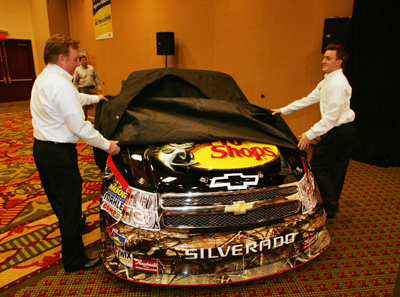 Richard Childress and grandson Austin Dillon unveil the Bass Pro Shops No. 3 Richard Childress Racing NASCAR Camping World Truck that Dillon will drive in 2010. The event took place Tuesday in Concord, N.C. during the NASCAR Sprint Media Tour Hosted by Charlotte Motor Speedway. (Credit: Harold Hinson Photography)