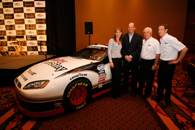 (Left to right) Sandi Stablein, Director of Marketing and Communications for Ruby Tuesday, Mark Young, Senior Vice President and Chief Marketing Officer for Ruby Tuesday, Roger Penske, NASCAR team owner, and Brad Keselowski, driver of the No. 22 Ruby Tuesday Dodge, pose during the NASCAR Sprint Media Tour hosted by Charlotte Motor Speedway and held at the Embassy Suites Monday in Concord, N.C. (Credit: Jason Smith/Getty Images)
