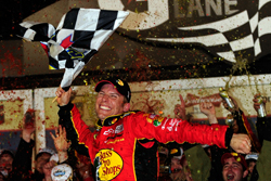 Jamie McMurray celebrates winning the Daytona 500 in his first race with Earnhardt Ganassi Racing. McMurray led two laps, the lowest total for a Daytona 500 winner. (Credit: Rusty Jarrett/Getty Images for NASCAR)