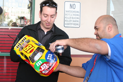 NASCAR Sprint Cup Series driver Kyle Busch talks with fellow RC racer Edwin Flores Tuesday in Las Vegas at HobbyTown USA -- a store where used to work. Busch was in his hometown to promote the Feb. 26-28 NASCAR Weekend at Las Vegas Motor Speedway.(Credit: John Bisci / Las Vegas Motor Speedway)
