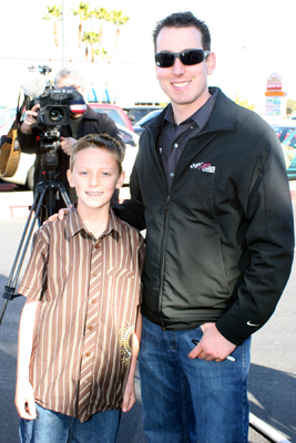 NASCAR Sprint Cup Series driver Kyle Busch says hi to Bandolero driver Austin Blair Tuesday in Las Vegas at HobbyTown USA -- a store where used to work. Busch was in his hometown to promote the Feb. 26-28 NASCAR Weekend at Las Vegas Motor Speedway. (Credit: John Bisci / Las Vegas Motor Speedway)