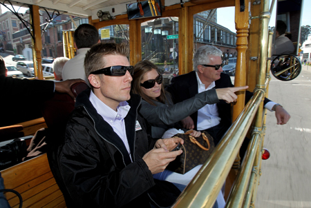 Daytona 500 champion Jamie McMurray, his wife Christy McMurray, and Infineon Raceway President and General Manager Steve Page take in the sights from inside a cable car during McMurray's victory tour of San Francisco on February 17, 2010 in San Francisco, California. (Photo by Ezra Shaw/Getty Images)