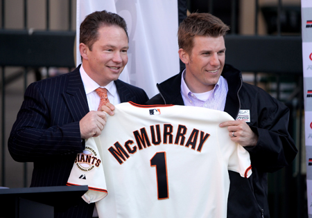 Daytona 500 champion Jamie McMurray is given a San Francisco Giants jersey by Russ Stanley, Managing Vice President, Ticket Services and Client Relations of the San Francisco Giants, during a press conference at Willie Mays Plaza in front of AT&T Park on February 17, 2010 in San Francisco, California. (Photo by Ezra Shaw/Getty Images)