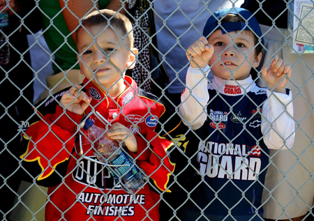 Young race fans look on during Saturday’s qualifying for the Daytona 500. Jeff Gordon, driver of the No. 24 DuPont Chevrolet, later signed autographs for them. (Credit: Nick Laham/Getty Images)