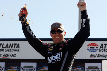 Kevin Harvick celebrates in Victory Lane after winning Sundays NASCAR Camping World Truck Series E-Z-GO 200 at Atlanta Motor Speedway. (Credit: Jason Smith/Getty Images for NASCAR)