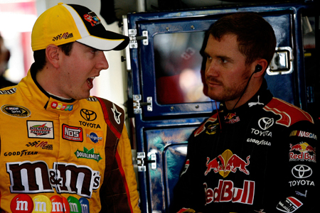Fellow Toyota drivers Kyle Busch and Brian Vickers talk in the garage during Friday’s practice for the NASCAR Sprint Cup Series Kobalt Tools 500 at Atlanta Motor Speedway.(Credit: Tom Whitmore/Getty Images for NASCAR)