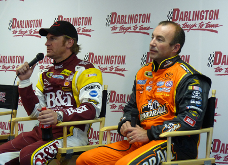 (Left to right) NASCAR Sprint Cup Series drivers Clint Bowyer and Marcos Ambrose answer questions in the James H. Hunter Media Center Tuesday during a Goodyear Tire test at Darlington Raceway in Darlington, S.C. (Credit: MotorRacingNetwork.com)